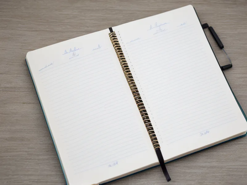 A hand-written tracking notebook showing daily joint stiffness scores.